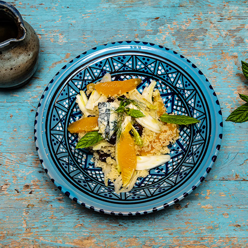 Couscous con gorgonzola piccante, arance, olive taggiasche, menta, finocchio a velo